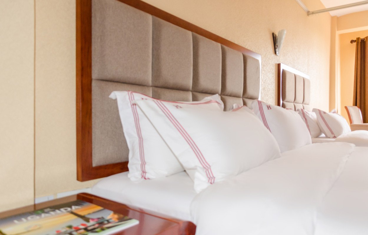 Make a room reservation at Hillside Plaza Hotel